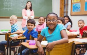 Children smiling in the classroom